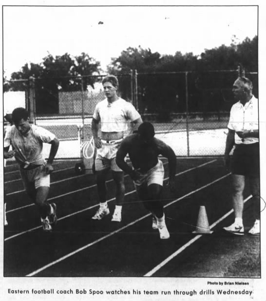 Coach Bob Spoo watches his team run drills